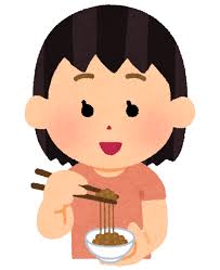納豆を食べる女性